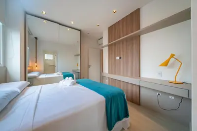 Uma cama ou camas num quarto em Apto moderno próximo a praia de Itapema PQ6542