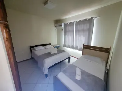 Uma cama ou camas num quarto em Casa Master com Piscina em Gov Celso Ramos