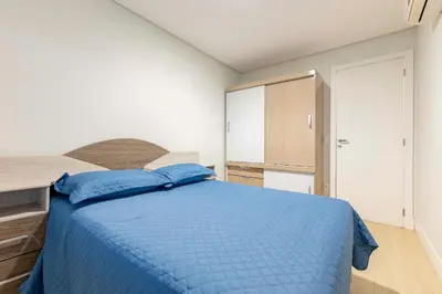 Uma cama ou camas num quarto em Condomínio com Piscina e Jacuzzi - Boulevard
