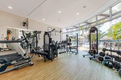 O centro de fitness e/ou as comodidades de fitness de Condomínio com Piscina e Jacuzzi - Boulevard
