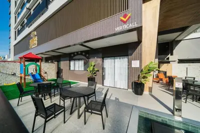 Um restaurante ou outro lugar para comer em Lindo Apartamento em Bombas - Areias de Bombas