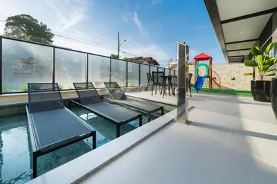 A piscina em ou perto de Lindo Apartamento em Bombas - Areias de Bombas