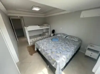 Uma cama ou camas num quarto em Ap pé na areia itapema frente mar