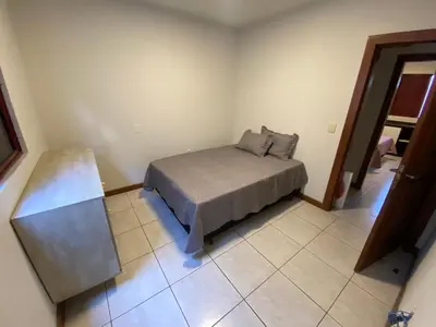 Uma cama ou camas num quarto em Cobertura quadra mar