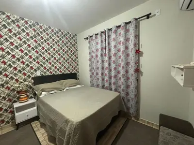 Uma cama ou camas num quarto em Casa de Praia Bombinhas