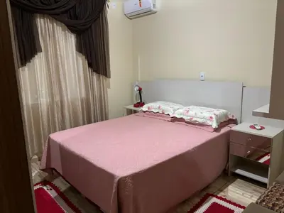 Uma cama ou camas num quarto em Casa de Praia Bombinhas