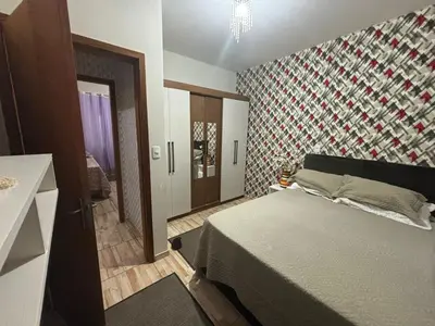 Uma cama ou camas num quarto em Casa de Praia Bombinhas