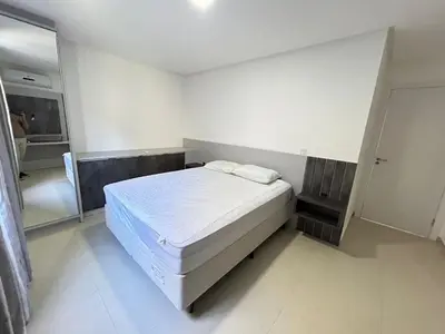 Uma cama ou camas num quarto em 082 - Apto confortável na praia de Bombas