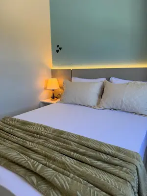 Uma cama ou camas num quarto em Novíssimo e confortável apartamento em Palmas