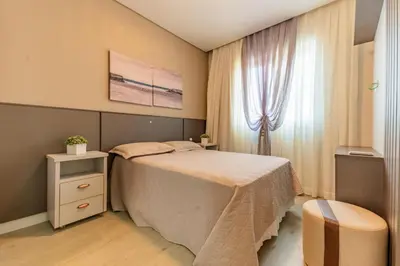 Uma cama ou camas num quarto em Sunset Residence