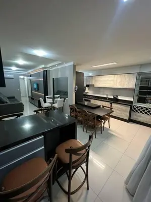 Uma área de estar em Apartamento Porto Belo - Perequê