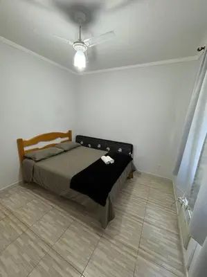 Uma cama ou camas num quarto em Apartamento Balneário Camboriú