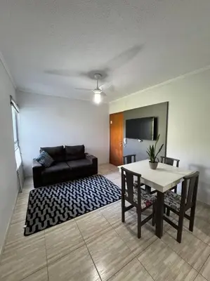 Uma televisão e/ou sistema de entretenimento em Apartamento Balneário Camboriú