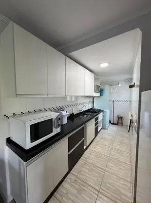 A cozinha ou kitchenette de Apartamento Balneário Camboriú