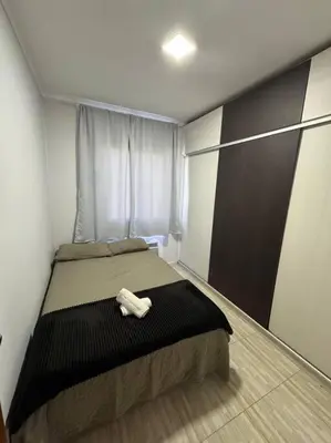 Uma cama ou camas num quarto em Apartamento Balneário Camboriú