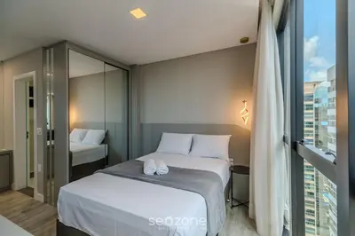 Uma cama ou camas num quarto em IFT - Ed. Infinity Tower Flat 350m da Meia Praia