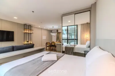 Uma cama ou camas num quarto em IFT - Ed. Infinity Tower Flat 350m da Meia Praia