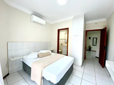 Uma cama ou camas num quarto em Sea Breeze - Brisa do Mar - Pé na Areia em Itapema