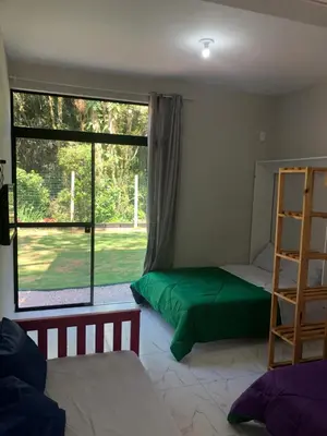 Uma cama ou camas num quarto em Saracura