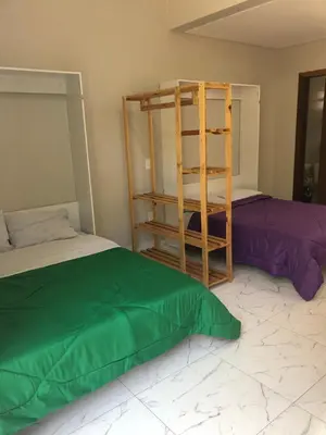 Uma cama ou camas num quarto em Saracura