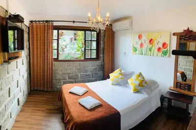 Uma cama ou camas num quarto em Apto 2 - com Jacuzzi e Vista Mar - Morada do Ganso Bombinhas