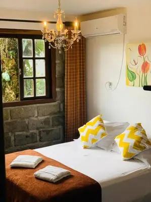 Uma cama ou camas num quarto em Apto 2 - com Jacuzzi e Vista Mar - Morada do Ganso Bombinhas