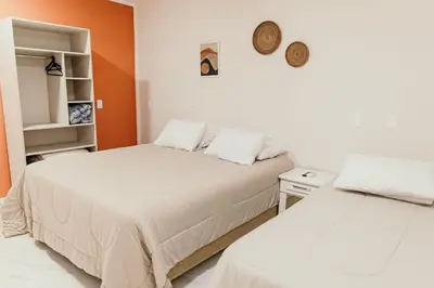 Uma cama ou camas num quarto em Pousada Áurea
