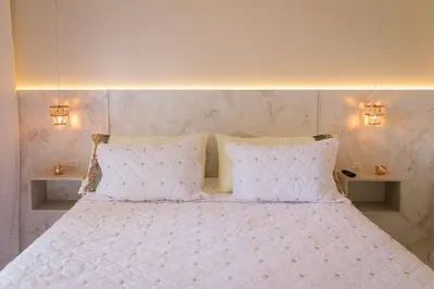Uma cama ou camas num quarto em Pousada Áurea
