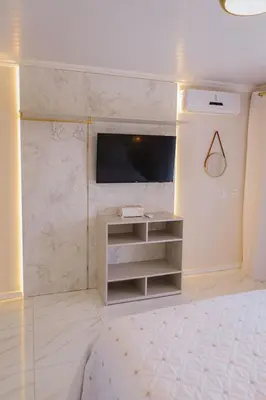 Uma cama ou camas num quarto em Pousada Áurea
