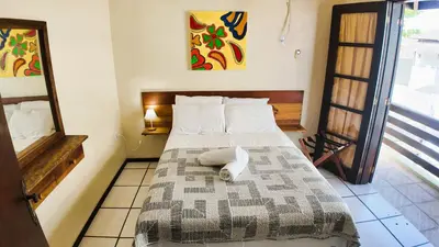 Uma cama ou camas num quarto em Água Marinha de Bombas - Bombinhas