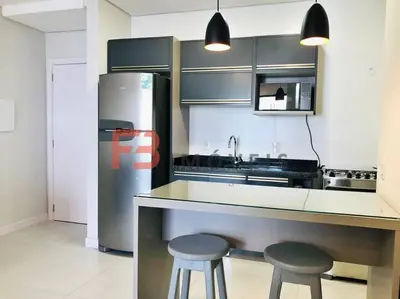 A cozinha ou kitchenette de Apartamento praia Bombas