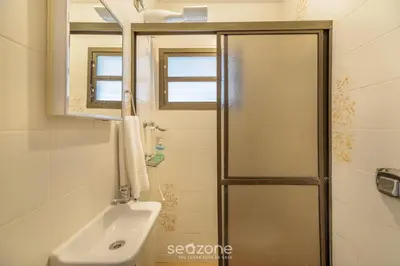 Uma casa de banho em Casa 6Q pé na areia em Bombinhas ABM0101