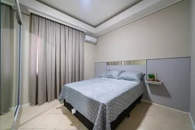 Uma cama ou camas num quarto em Lindo apartamento na Avenida