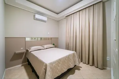 Uma cama ou camas num quarto em Lindo apartamento na Avenida