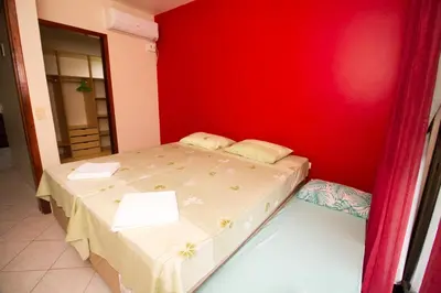 Uma cama ou camas num quarto em Residencial Andorinhas
