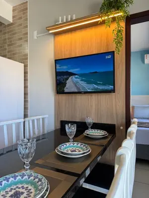 Uma televisão e/ou sistema de entretenimento em Residencial Golfinho - Aconchegante apê em Palmas