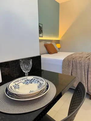 Uma cama ou camas num quarto em Novíssimo studio para casal