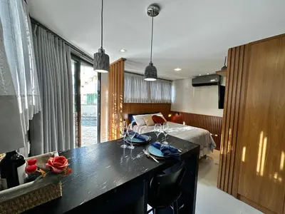 Uma cama ou camas num quarto em Loft para Casal em Bombinhas - Sem Garagem