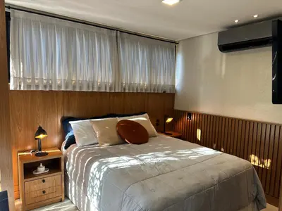 Uma cama ou camas num quarto em Loft para Casal em Bombinhas - Sem Garagem