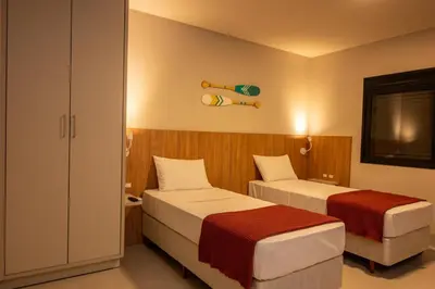 Uma cama ou camas num quarto em Pousada Caminho do Bosque