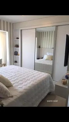 Uma cama ou camas num quarto em Frente Mar Aconchegante
