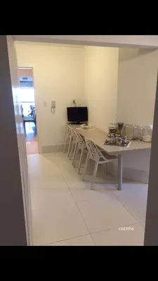 Uma televisão e/ou sistema de entretenimento em Frente Mar Aconchegante