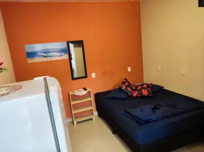 Uma cama ou camas num quarto em Loft 03 c ar condicionado proximo praias e Expocenter BC