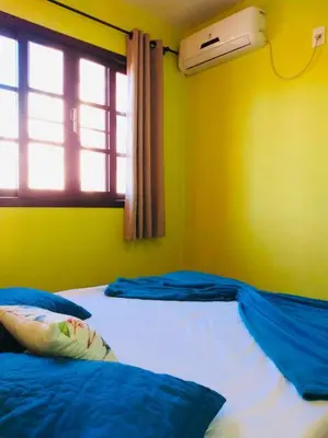 Uma cama ou camas num quarto em 6 - Apartamento de 02 quartos com jacuzzi em Bombas