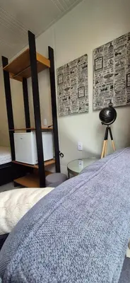 Uma cama ou camas num quarto em Loft aconchegante próximo do mar e do Expocentro
