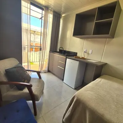 A cozinha ou kitchenette de Loft aconchegante próximo do mar e do Expocentro