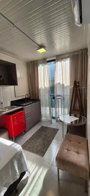 A cozinha ou kitchenette de Loft aconchegante próximo do mar e do Expocentro