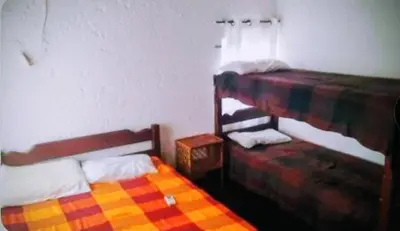 Uma cama ou camas num quarto em Residencial verde oliva AP 2