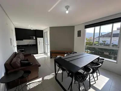 Uma televisão e/ou sistema de entretenimento em Apartamento com Suite em Palmas
