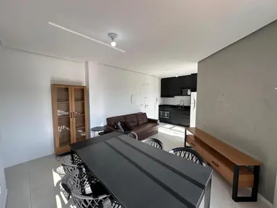 Uma televisão e/ou sistema de entretenimento em Apartamento com Suite em Palmas